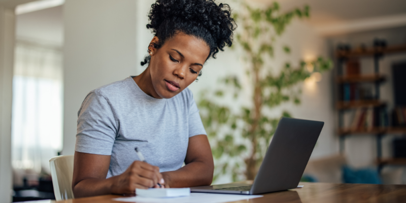 women writing a note